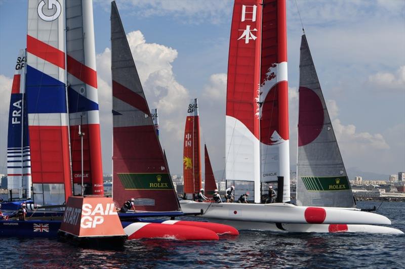 Close sailing between Great Britain SailGP Team helmed by Dylan Fletcher and Japan SailGP Team skippered by Nathan Outteridge as they compete in a practice race ahead of the final SailGP event of Season 1 in Marseille, France photo copyright Ricardo Pinto for SailGP taken at  and featuring the F50 class