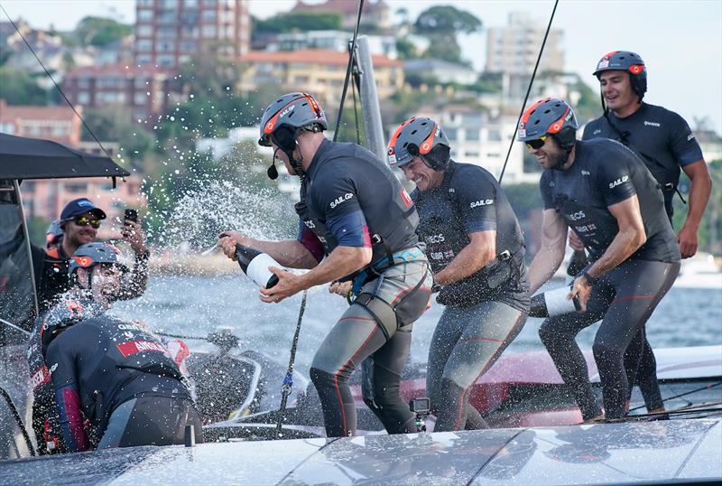 Luke Parkinson, flight controller, and Richard Mason, grinder, spray champagne on Ben Ainslie, helmsman, and Iain Jensen, wing trimmer as Great Britain SailGP Team celebrate winning the final match race and SailGP Sydney photo copyright Bob Martin for SailGP taken at  and featuring the F50 class