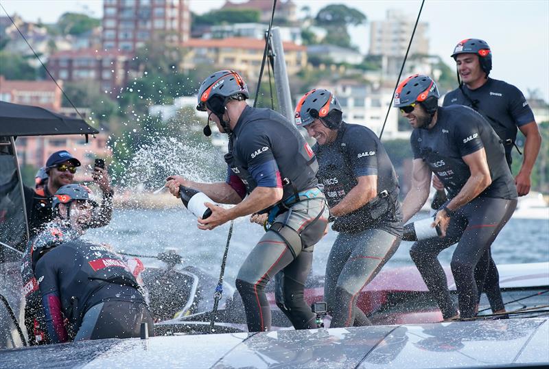 Luke Parkinson, flight controller, and Richard Mason, grinder, spray champagne on Ben Ainslie, helmsman, and Iain Jensen, wing trimmer as Great Britain SailGP Team celebrate winning the final match race and SailGP Sydney - photo © Bob Martin for SailGP