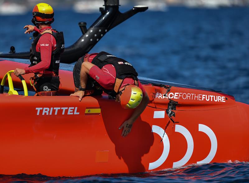 Spain SailGP Team check the hull of the F50 catamaran on Race Day 2 in France SailGP photo copyright Ricardo Pinto for SailGP taken at  and featuring the F50 class