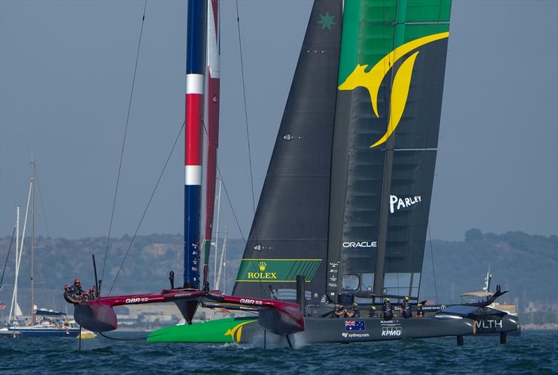 Great Britain SailGP Team helmed by Ben Ainslie moves in front of Australia SailGP Team helmed by Tom Slingsby. Race Day 1 at Spain SailGP, Event 6, Season 2 in Cadiz, Andalucia, Spain photo copyright Thomas Lovelock for SailGP taken at  and featuring the F50 class