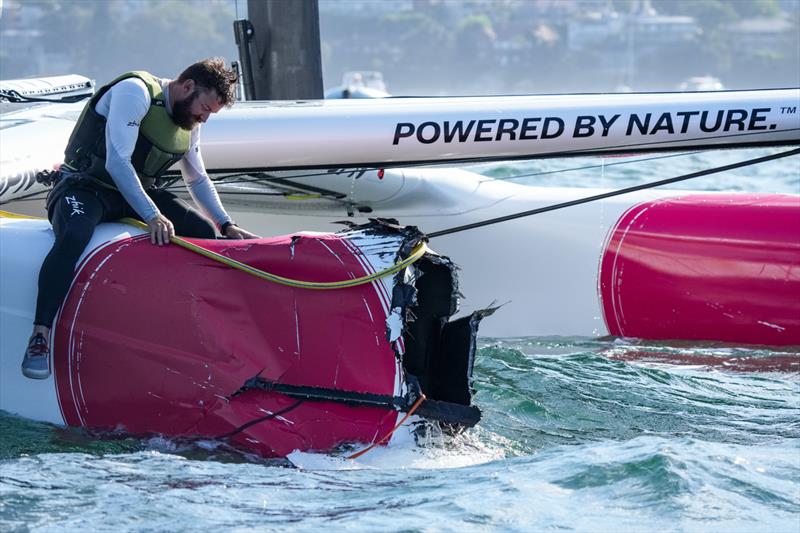 A Japan SailGP Team member helmed by sits on their damaged F50 catamaran after a collision with Great Britain SailGP Team photo copyright Bob Martin/SailGP taken at Woollahra Sailing Club and featuring the F50 class