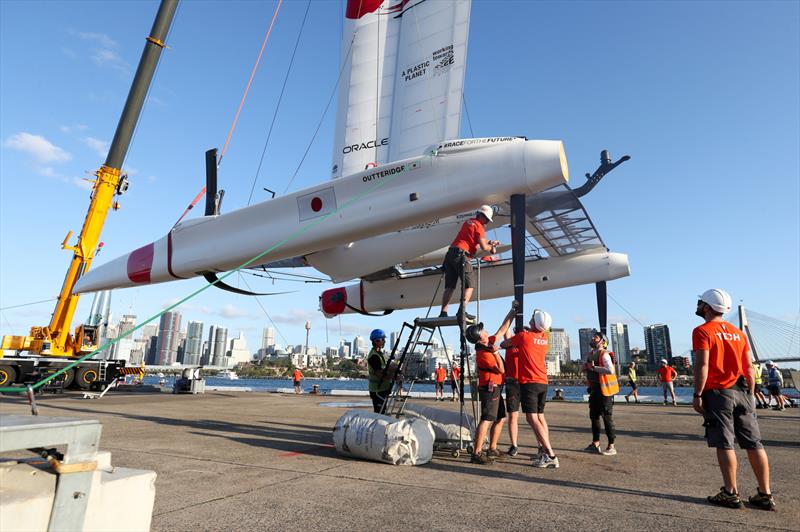 Japan SailGP Team F50 catamaran being craned out of the water at the end of Race Day 1 after colliding with Great Britain SailGP Team  - photo © Brett Costello/SailGP