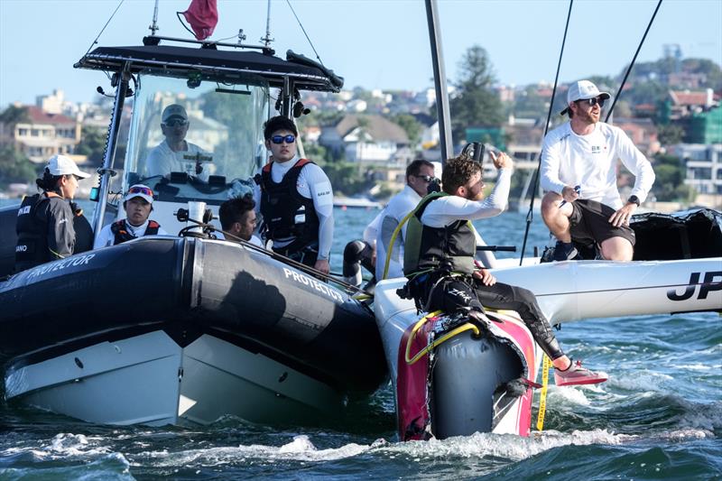 Japan SailGP Team members helmed by Nathan Outterridge sit on their damaged F50 catamaran after a collision with Great Britain SailGP Team  - photo © Bob Martin/SailGP