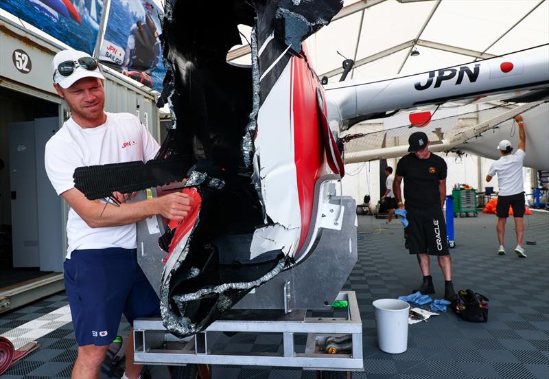 Nathan Outteridge, CEO & driver of Japan SailGP Team, looks at the damage to the F50 catamaran caused by a collision with Great Britain SailGP Team, on Race Day 2. Australia Sail Grand Prix photo copyright Patrick Hamilton/SailGP taken at Woollahra Sailing Club and featuring the F50 class