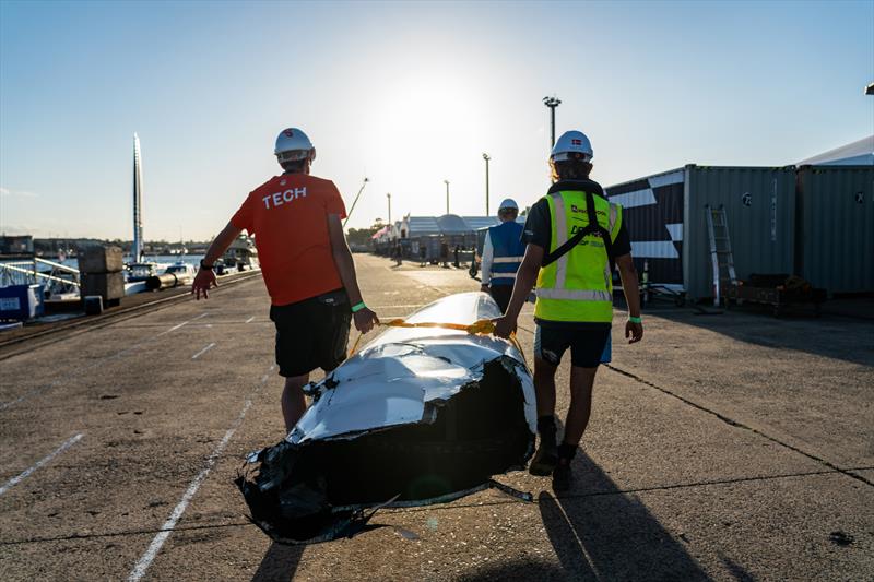 Technical crew carry the damaged Japan SailGP Team F50 catamaran bow after the collision with Great Britain SailGP Team SailGP Team on Race Day 1. Australia Sail Grand Prix photo copyright Beau Outteridge/SailGP taken at Woollahra Sailing Club and featuring the F50 class