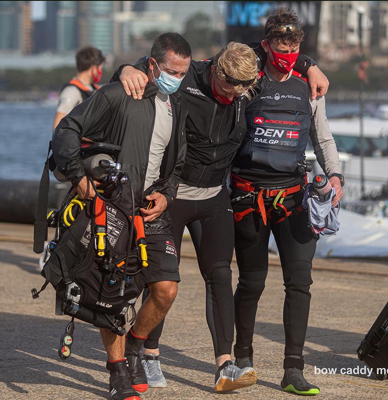 An injured Danish crew member gets some assistance photo copyright Bow Caddy Media taken at  and featuring the F50 class