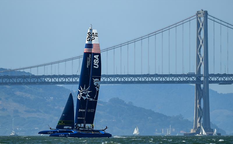 USA SailGP Team helmed by Jimmy Spithill sail alongside the Oakland Bay Bridge during a practice session ahead of San Francisco SailGP, Season 2 in San Francisco, USA photo copyright Ricardo Pinto for SailGP taken at  and featuring the F50 class