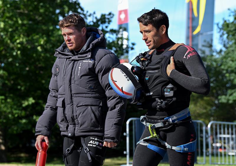 Quentin Delapierre, driver of France SailGP Team, speaks with Tom Slingsby, CEO and driver of Australia SailGP Team, as they arrive back at the Technical Base following the racing on Race Day 1 of the T-Mobile United States Sail Grand Prix  - photo © Ricardo Pinto for SailGP