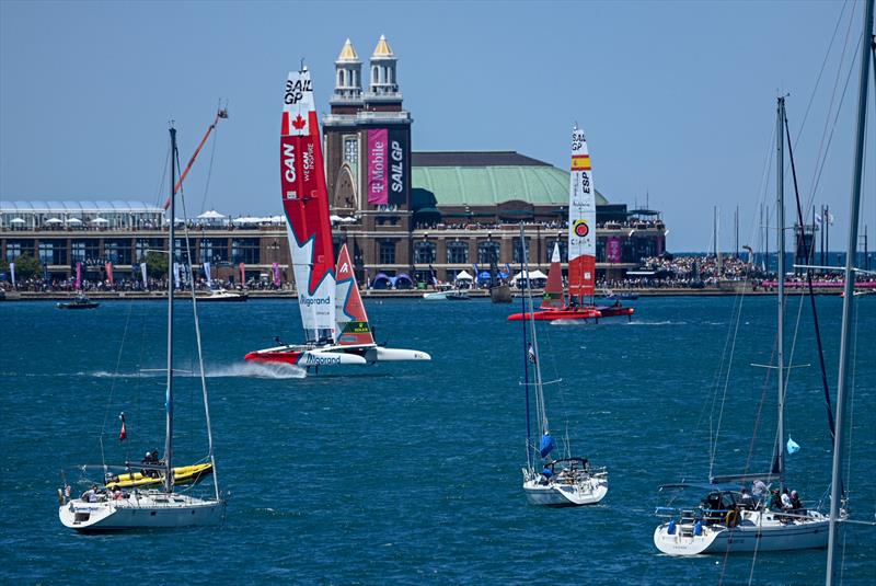 Canada SailGP Team and Spain SailGP Team sail past the Navy Pier and spectator boats on Race Day 1 of the T-Mobile United States Sail Grand Prix | Chicago at Navy Pier, Lake Michigan, Season 3 - photo © Jon Buckle/SailGP