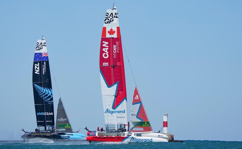 New Zealand SailGP Team co-helmed by Peter Burling and Blair Tuke and Canada SailGP Team helmed by Phil Robertson in action on Race Day 1 of the T-Mobile United States Sail Grand Prix , Chicago - June 2022 - photo © Bob Martin/SailGP