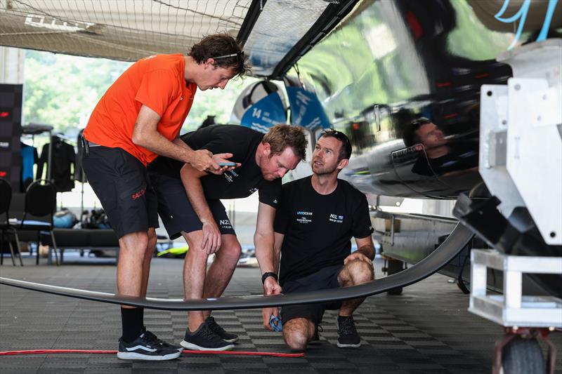 Scott Randell of the New Zealand SailGP technical team examines the foil on the New Zealand SailGP Team F50 catamaran prior to racing on Race Day 1 of the T-Mobile United States Sail Grand Prix Chicago at Navy Pier, Lake Michigan, Season 3, June 2022 photo copyright Simon Bruty/SailGP taken at Chicago Yacht Club and featuring the F50 class