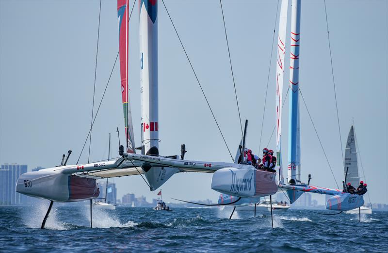 Canada SailGP Team sail past Great Britain SailGP Team on Race Day 2  - T-Mobile United States Sail Grand Prix, Chicago at Navy Pier, Lake Michigan, Season 3 - photo © Bob Martin/SailGP