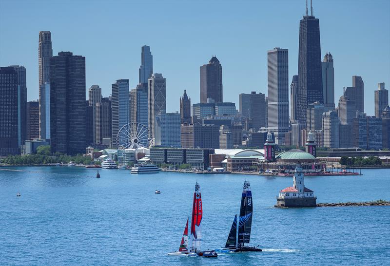 Canada SailGP Team and New Zealand SailGP Team sail past the Chicago skyline and Chicago Harbour LIghthouse ahead of T-Mobile United States Sail Grand Prix June 2022 photo copyright Simon Bruty/SailGP taken at Chicago Yacht Club and featuring the F50 class