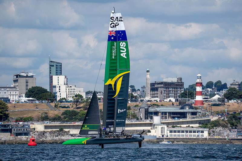 Australia SailGP Team helmed by Tom Slingsby sail past the waterfront and Smeaton's Tower during a practice session ahead of the Great Britain Sail Grand Prix | Plymouth in Plymouth, England - photo © Bob Martin for SailGP