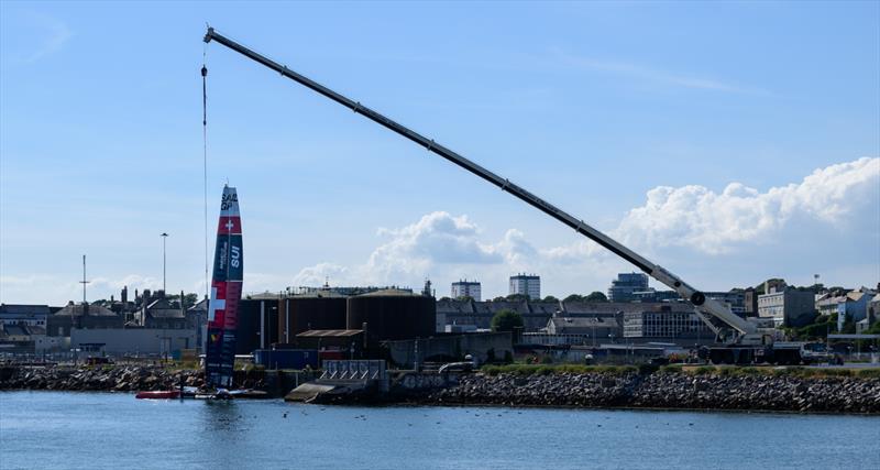 Switzerland SailGP Team F50 catamaran being craned into the the Technical Base after a practice session ahead of the Great Britain Sail Grand Prix | Plymouth in Plymouth, England. 29th July 2022 - photo © Ricardo Pinto/SailGP