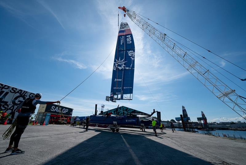 The wing of the USA SailGP Team F50 catamaran is lifted by crane in the Technical Base after a practice session ahead of the Great Britain Sail Grand Prix | Plymouth in Plymouth, England. 29th July 2022 - photo © Jon Super/SailGP