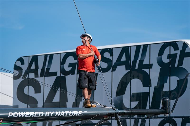 A crew member cleans the Australia SailGP Team F50 catamaran at the Technical Base after a practice session ahead of the Great Britain Sail Grand Prix | Plymouth in Plymouth, England. 29th July 2022 - photo © Jon Super/SailGP