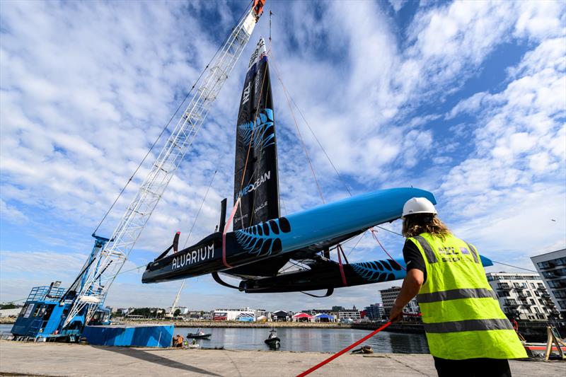New Zealand SailGP Team F50 catamaran being craned into the water at the Technical Base prior to a practice session ahead of the Great Britain Sail Grand Prix | Plymouth in Plymouth, England. 29th July, 2022 - photo © Ricardo Pinto/SailGP