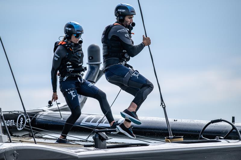 Blair Tuke, wing trimmer of New Zealand SailGP Team, and Jo Aleh of New Zealand SailGP Team run across the boat during a practice session ahead of the Great Britain Sail Grand Prix | Plymouth in Plymouth, England. 28th July 2022 - photo © Ricardo Pinto/SailGP