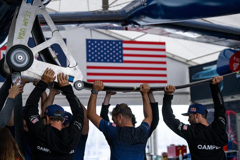 Crew members help prepare the USA SailGP Team F50 catamaran at the Technical Base prior to racing on Race Day 2 of Great Britain Sail Grand Prix | Plymouth - photo © Ricardo Pinto for SailGP