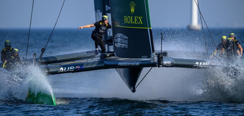 Sam Newton, grinder of Australia SailGP Team, crosses the F50 catamaran during a practice session ahead Denmark Sail Grand Prix in Copenhagen photo copyright Ricardo Pinto / SailGP taken at Royal Danish Yacht Club and featuring the F50 class