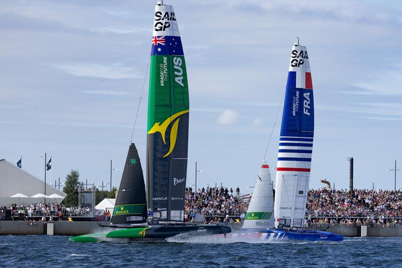 Australia SailGP Team helmed and France SailGP Team  sail past spectators at the Race Village on Race Day 2 of the  Denmark Sail Grand Prix in Copenhagen, photo copyright Felix Diemer /SailGP taken at Royal Danish Yacht Club and featuring the F50 class