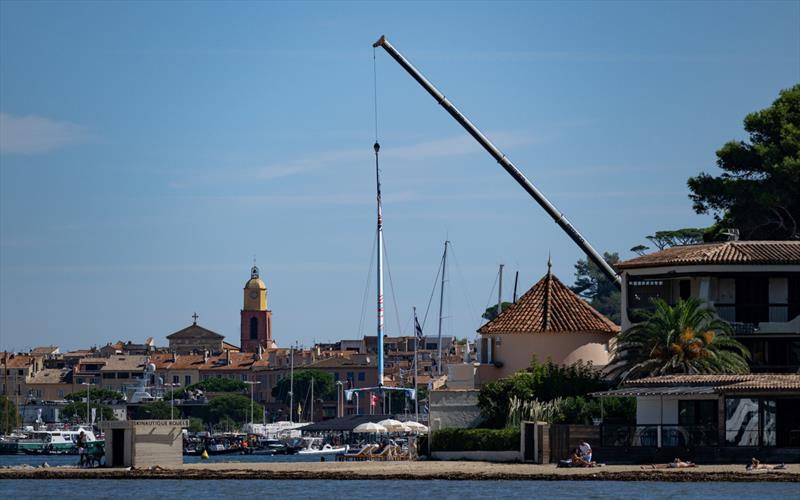 Great Britain SailGP Team F50 catamaran as it is craned onto the water at the Technical Base overlooking the bell tower and old town of Saint Tropez - Range Rover France Sail Grand Prix in Saint Tropez, - photo © John Buckle/SailGP