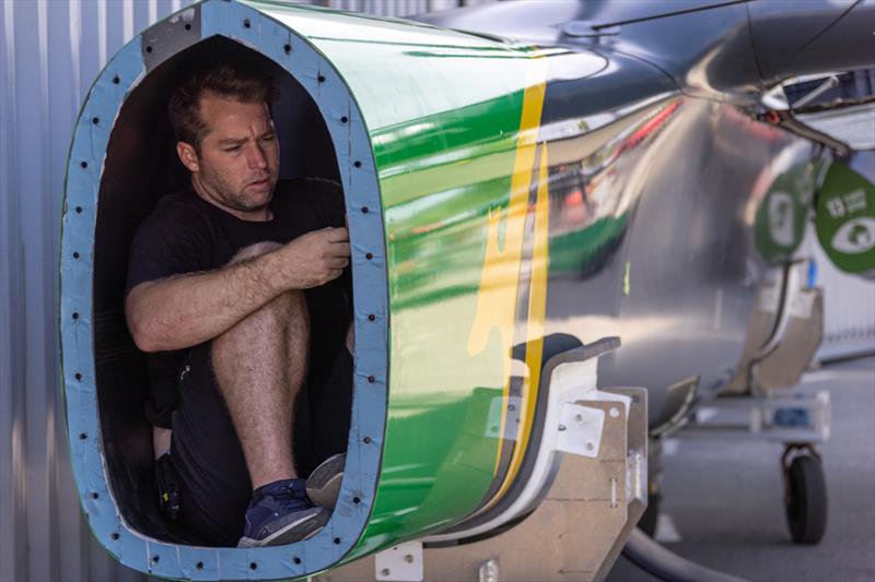A member of the Australia SailGP shore team works inside the hull of the Australia SailGP F50 before the bow is fitted ahead of the Range Rover France Sail Grand Prix in Saint Tropez photo copyright David Gray/SailGP taken at Société Nautique de Saint-Tropez and featuring the F50 class