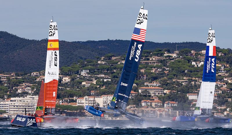 The F50 catamaran of USA SailGP Team helmed by Jimmy Spithill goes airborne between Spain SailGP Team and France SailGP Team on Race Day 1 of the Range Rover France Sail Grand Prix in Saint Tropez, France - photo © David Gray for SailGP