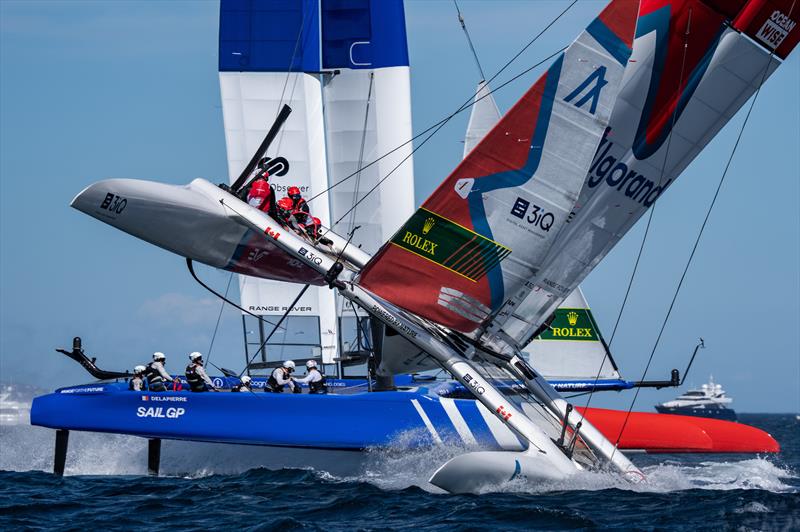 Canada SailGP Team helmed by Phil Robertson nearly capsize as France SailGP Team helmed by Quentin Delapierre sail closely past during the second race on Race Day 1 of the Range Rover France Sail Grand Prix in Saint Tropez, France - photo © Bob Martin for SailGP