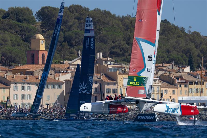 New Zealand SailGP Team, USA SailGP Team and Spain SailGP Team  sail past the bell tower and old town of Saint Tropez on Race Day 2 of the Range Rover France Sail Grand Prix in Saint Tropez, France photo copyright Felix Diemer/SailGP taken at Société Nautique de Saint-Tropez and featuring the F50 class