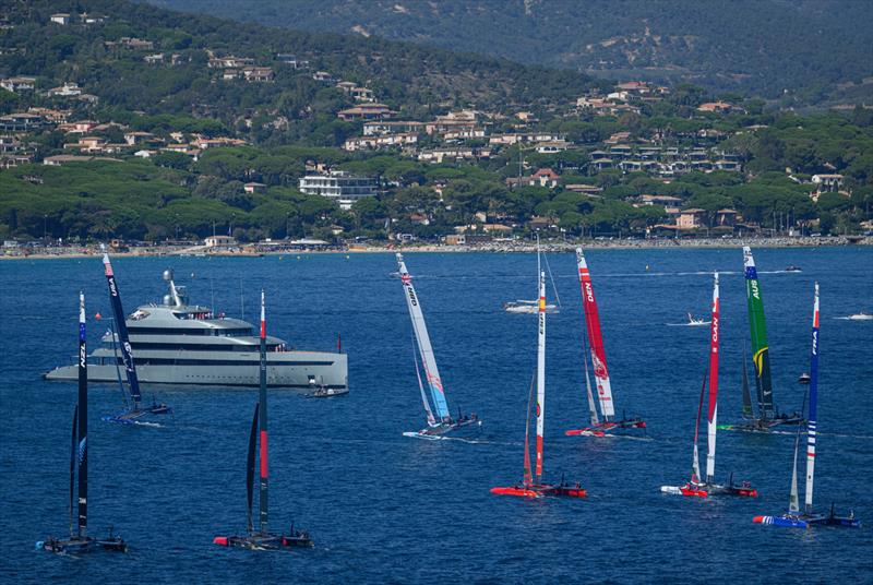 The Sail GP fleet in action near superyacht Savannah on Race Day 2 of the Range Rover France Sail Grand Prix in Saint Tropez, France photo copyright Jon Buckle/SailGP taken at Société Nautique de Saint-Tropez and featuring the F50 class