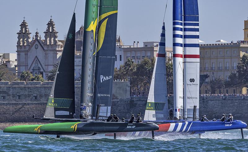 Australia SailGP Team helmed by Tom Slingsby and France SailGP Team helmed by Quentin Delapierre sail past the Cadiz Cathedral on Race Day 1 of the Spain Sail Grand Prix in Cadiz, Andalusia, Spain. 24th September - photo © Felix Diemer for SailGP