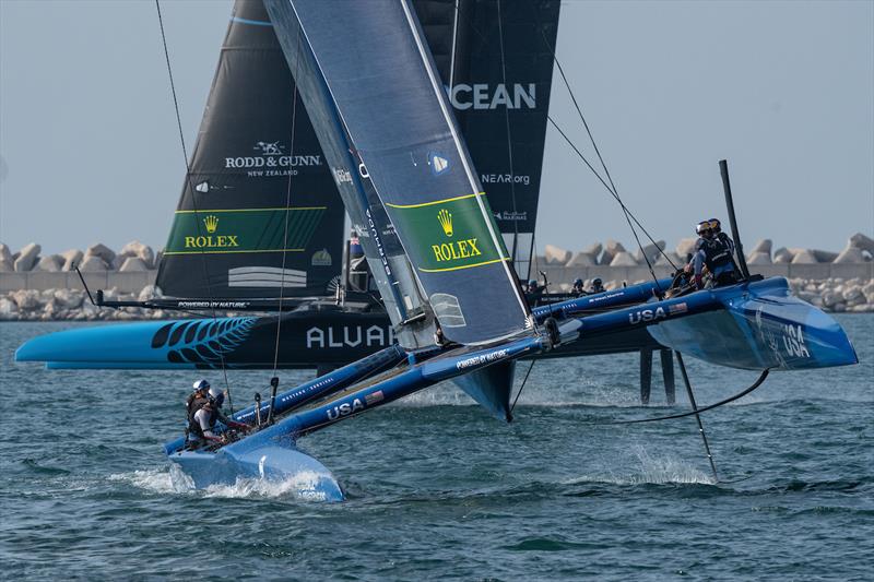 USA SailGP Team USA helmed by Jimmy Spithill sails past New Zealand SailGP Team helmed by Peter Burling during a practice session ahead of the Dubai Sail Grand Prix presented by P&O Marinas in Dubai, United Arab Emirates photo copyright Bob Martin for SailGP taken at  and featuring the F50 class