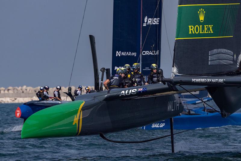 Australia SailGP Team helmed by Tom Slingsby in action as they sail past USA SailGP Team during a practice session ahead of the Dubai Sail Grand Prix presented by P&O Marinas in Dubai, United Arab Emirates - photo © Felix Diemer for SailGP