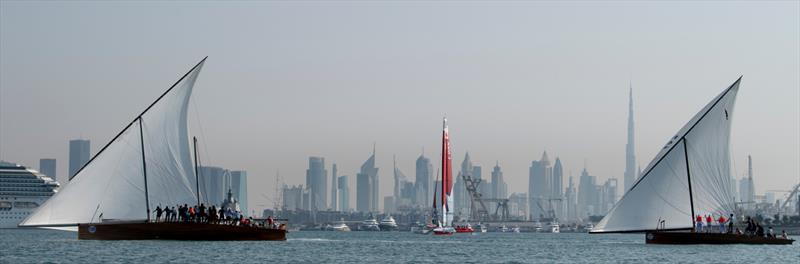 Canada SailGP team F50 sailing between the traditional sailing dhows  - Practice - November 11, 2022 - SailGP Dubai  photo copyright Ricardo Pinto/SailGP taken at Dubai Offshore Sailing Club and featuring the F50 class