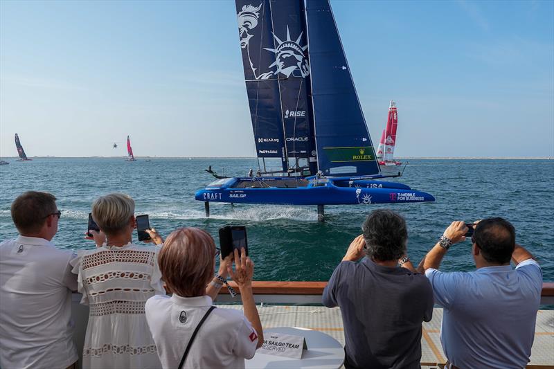 Guests enjoy the Adrenaline Lounge as USA SailGP Team helmed by Jimmy Spithill F50 catamaran foils past on Race Day 1 of the Dubai Sail Grand Prix presented by P&O Marinas in Dubai, United Arab Emirates photo copyright Andrew Baker for SailGP taken at  and featuring the F50 class