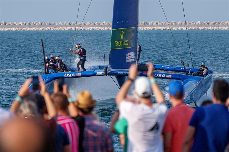 Spectators watch on as USA SailGP Team helmed by Jimmy Spithill sail closely past the Race Village on Race Day 2 of the Dubai Sail Grand Prix presented by P&O Marinas in Dubai, United Arab Emirates photo copyright Joe Toth for SailGP taken at  and featuring the F50 class