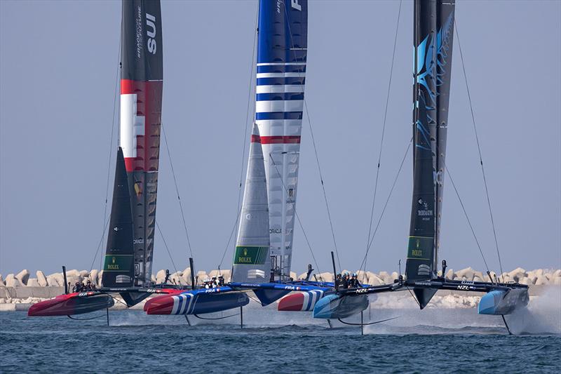 Switzerland SailGP Team helmed by Sebastien Schneiter, France SailGP Team helmed by Quentin Delapierre and New Zealand SailGP Team helmed by Peter Burling in action on Race Day 2 of the Dubai Sail Grand Prix photo copyright Felix Diemer for SailGP taken at  and featuring the F50 class