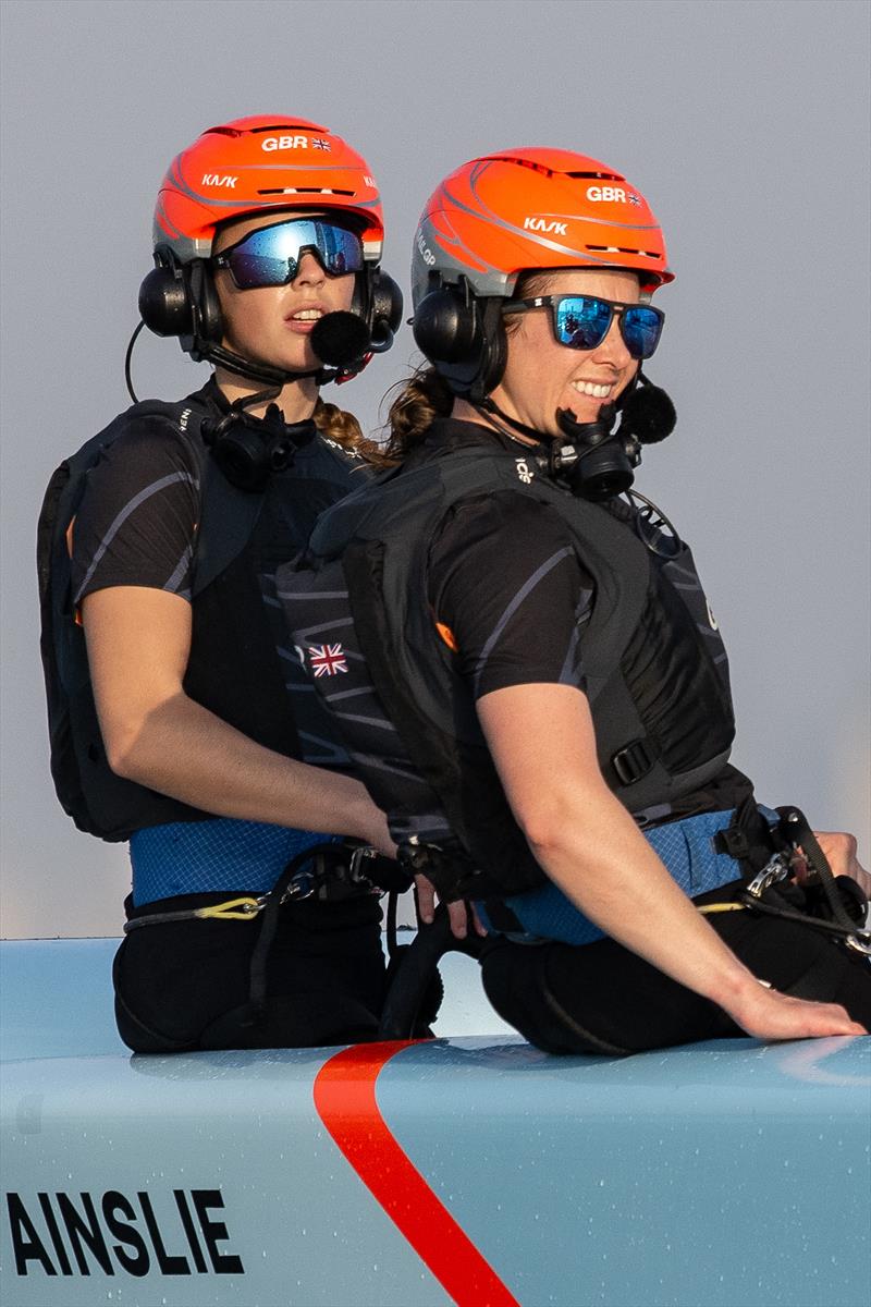 Hattie Rogers, strategist of Great Britain SailGP Team, at the wheel alongside Hannah Diamond, strategist of Great Britain SailGP Team, during a practice session ahead of the Dubai Sail Grand Prix presented by P&O Marinas in Dubai, United Arab Emirates photo copyright Ricardo Pinto for SailGP taken at  and featuring the F50 class