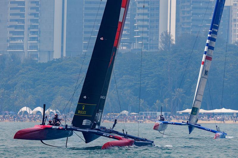 Switzerland SailGP Team helmed by Sebastien Schneiter and France SailGP Team helmed by Quentin Delapierre racing during the first on Race Day 1 of the Singapore Sail Grand Prix presented by the Singapore Tourism Board - photo © Felix Diemer for SailGP
