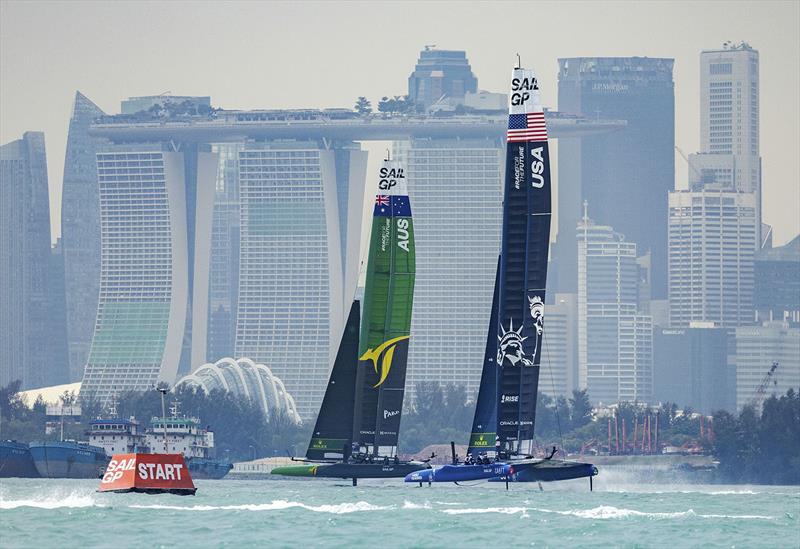 Australia SailGP Team helmed by Tom Slingsby and USA SailGP Team helmed by Jimmy Spithill in action during a practice session with the city skyline in the background ahead of the Singapore Sail Grand Prix  - photo © Ian Walton for SailGP