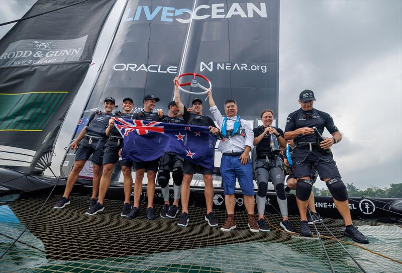 LI Quanhai, President of World Sailing hands the trophy to Peter Burling, Co-CEO and driver of New Zealand SailGP Team, after their victory in the final on Race Day 2 of the Singapore Sail Grand Prix  photo copyright Felix Diemer/SailGP taken at Singapore Yacht Club and featuring the F50 class