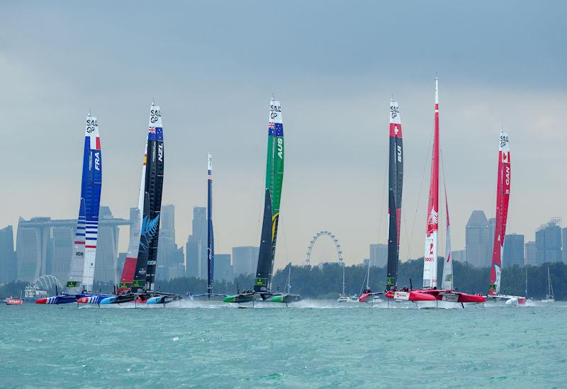 The F50 fleet races towards the start line on Race Day 2 with the Marina Bay Sands Hotel and the city skyline behind themof the Singapore Sail Grand Prix presented by the Singapore Tourism Board - photo © Bob Martin for SailGP