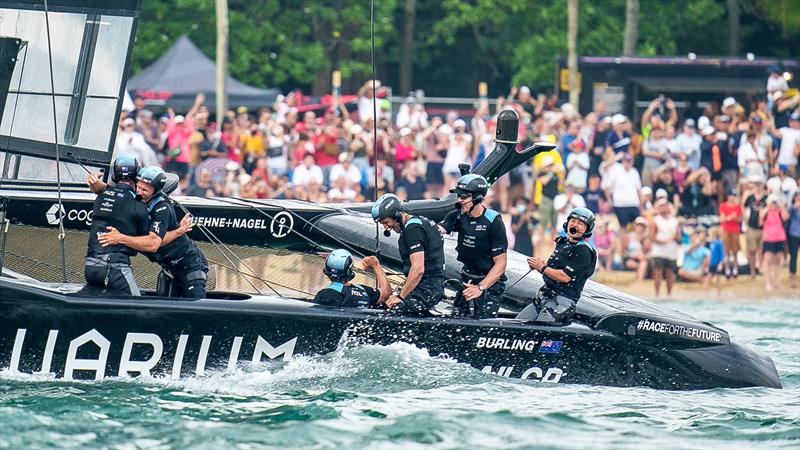 New Zealand SailGP crew celebrate as they cross the finish line to win the final race on Race Day 2 of the Singapore Sail Grand Prix  photo copyright Bob Martin/SailGP taken at Republic of Singapore Yacht Club and featuring the F50 class