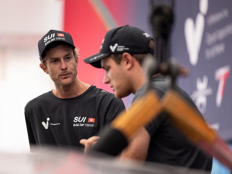 Sebastien Schneiter, co-driver and strategist of Switzerland SailGP Team, talks with new team member Will Ryan of the Switzerland SailGP Team in the technical area ahead of the KPMG Australia Sail Grand Prix in Sydney, Australia. Tuesday 14th February - photo © Felix Diemer for SailGP