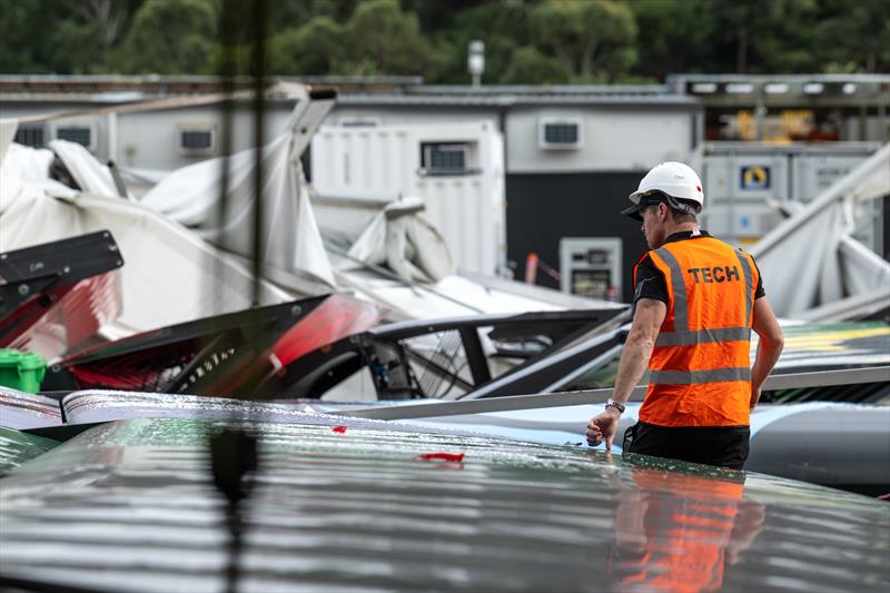 Tom Slingsby, CEO and driver of Australia SailGP Team, inspects the damage in the technical area following the storm after racing on Race Day 1 of the KPMG Australia Sail Grand Prix - photo © Ricardo Pinto/SailGP