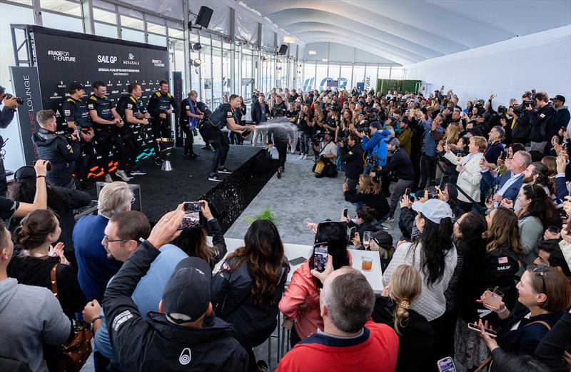 Kyle Langford, wing trimmer of Australia SailGP Team, sprays Barons de Rothschild champagne on stage in the Adrenaline Lounge - Mubadala SailGP Season 3 Grand Final in San Francisco, USA - photo © Katelyn Mulcahy/SailGP