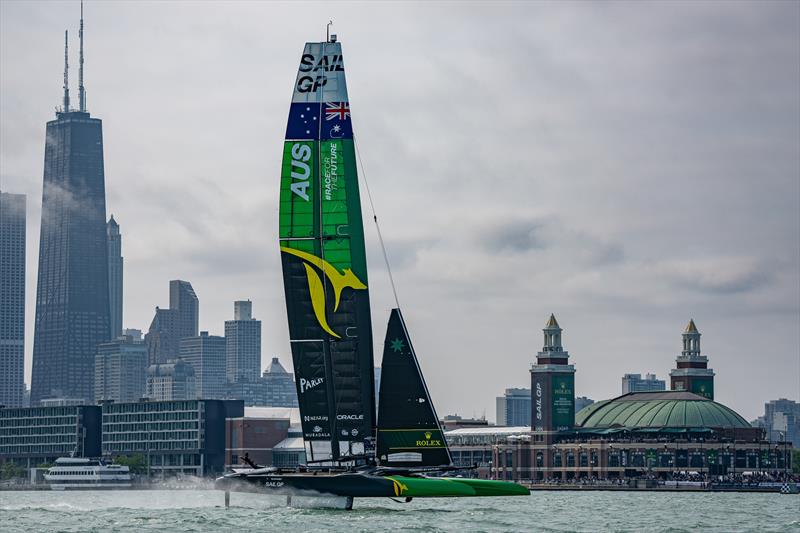 Australia SailGP Team helmed by Tom Slingsby sail closely past Navy Pier on Race Day 1 of the Rolex United States Sail Grand Prix | Chicago photo copyright Bob Martin/SailGP taken at Lake Michigan Yacht Club and featuring the F50 class